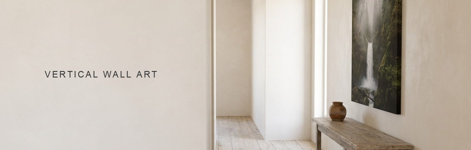 Vertical wall art on a narrow wall with a tall waterfall canvas