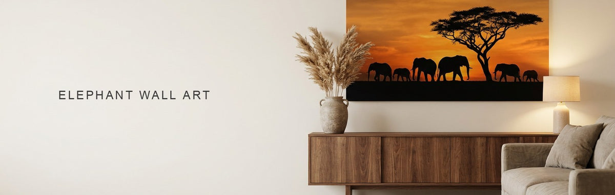 Elephant wall art above a console, a herd silhouetted against a sunset on canvas