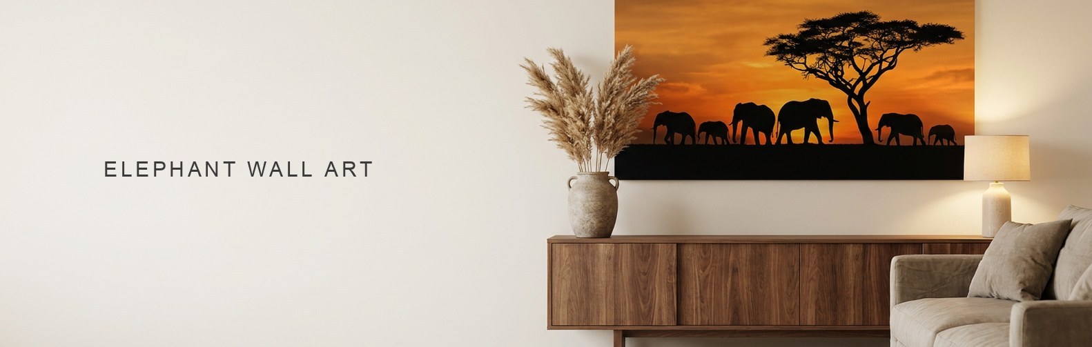 Elephant wall art above a console, a herd silhouetted against a sunset on canvas