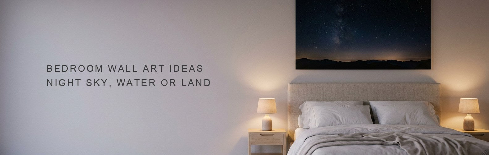 Bedroom wall art ideas: a dark night sky canvas above an upholstered bed in low light