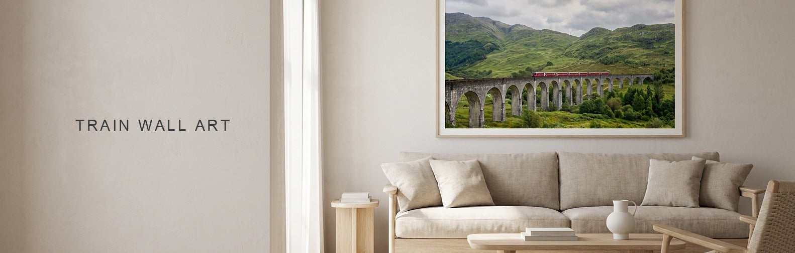 Train wall art above a sofa, a red alpine train on a stone viaduct on canvas