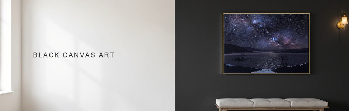 Black canvas art: a dark night sky canvas lit by a brass picture light on a charcoal wall