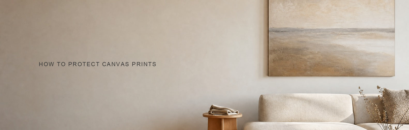 How to protect canvas prints: a gallery-wrapped canvas hung clear of direct sunlight with a microfibre cloth on a side table