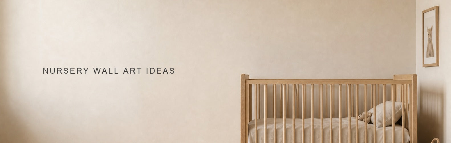 Nursery wall art ideas: a framed print beside a cot with the wall above it left bare