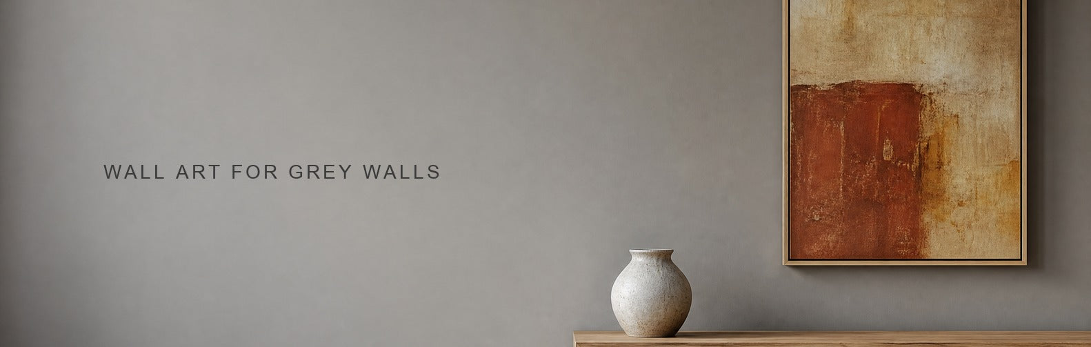 Wall art for grey walls: a warm ochre framed piece against a soft grey wall