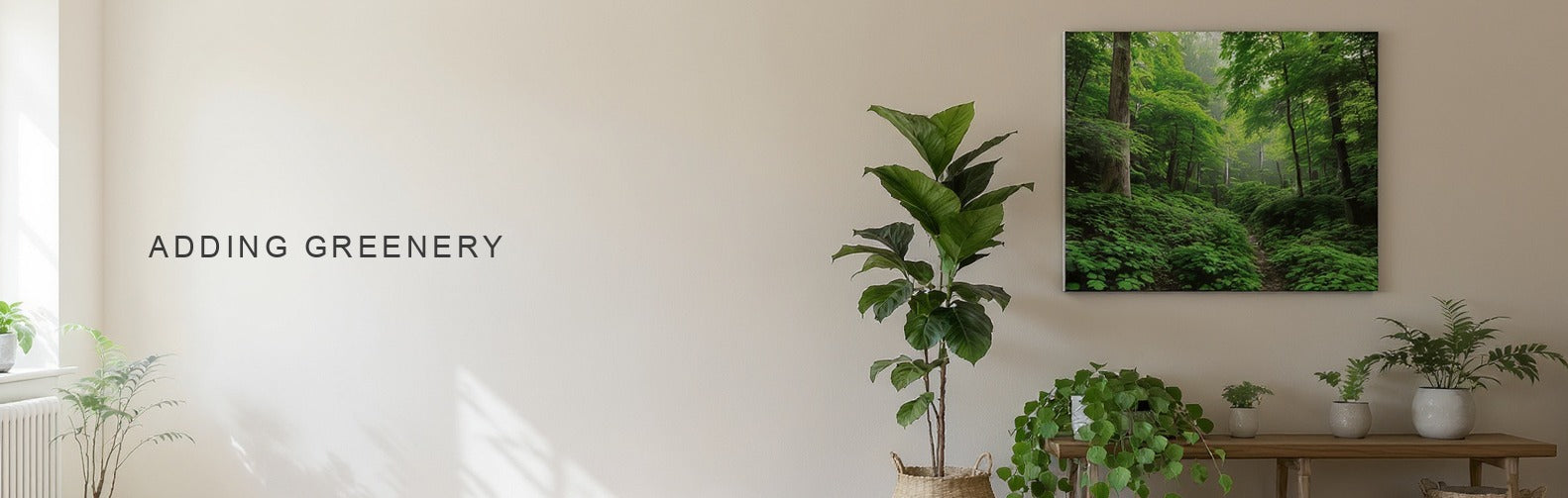 Adding greenery to the house: a green forest canvas among a fiddle leaf fig and trailing pothos