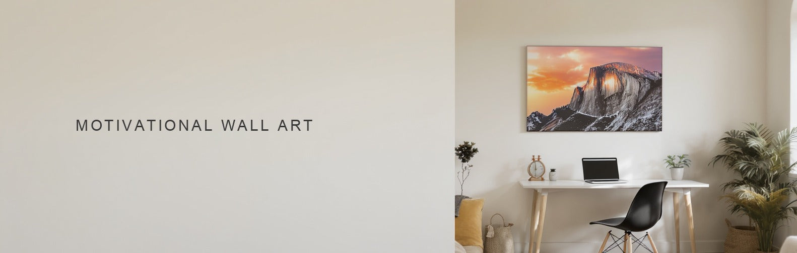 Motivational wall art: a sunrise over a mountain ridge canvas hung above a clean home office desk