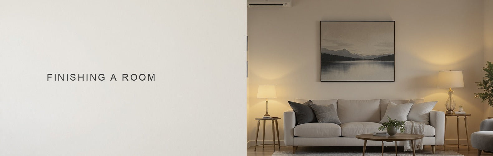 Finishing a room: a canvas centred above the sofa with a correctly sized rug and a lit lamp
