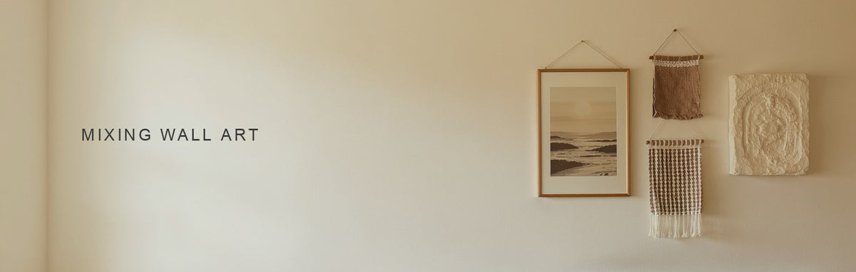 Mixing wall art: a canvas print, a woven textile hanging and a plaster relief arranged above a console