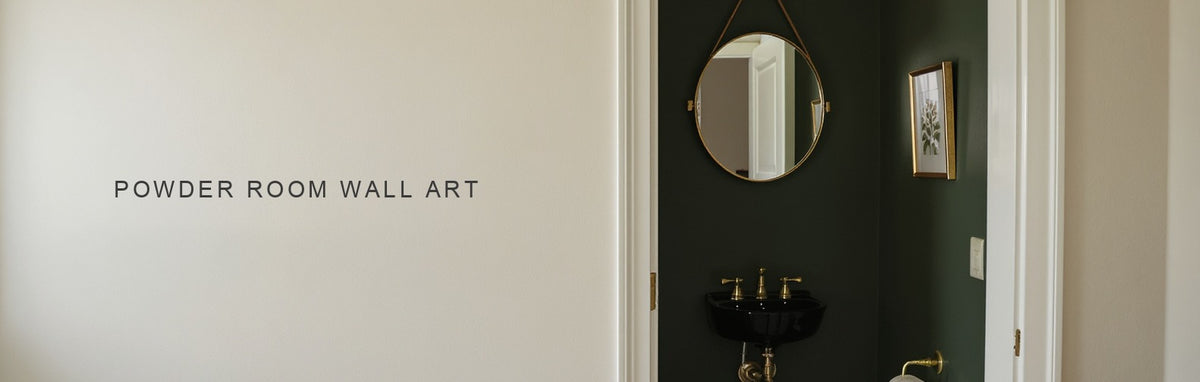 Powder room wall art: two small botanical prints stacked on a narrow dark green wall with brass fittings