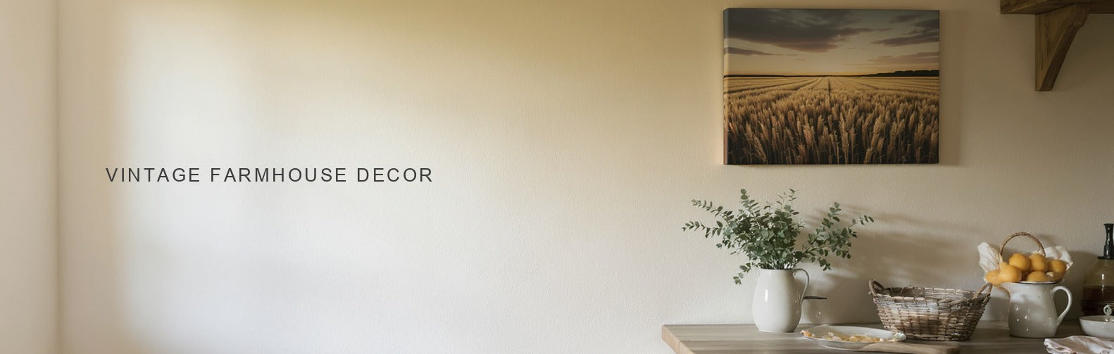 Vintage farmhouse decor: a wheat field at dusk canvas above a dresser with enamel jugs and pine
