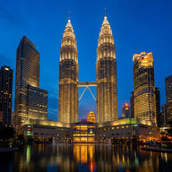 Malaysia Wall Art canvas print, Kuala Lumpur in Malaysia, the twin steel towers and their sky bridge lit against a deep blue