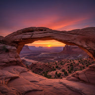 Utah Wall Art canvas print, a sandstone arch framing red rock desert and distant mesas at sunset