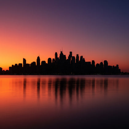 Skyline Wall Art canvas print, a great city skyline in silhouette at dusk