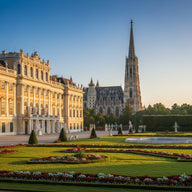 Vienna Wall Art canvas print, a grand baroque palace facade and formal gardens with the gothic cathedral spire beyond