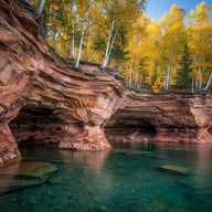 Wisconsin Wall Art canvas print, sandstone sea caves and clear blue lake water with birch forest on the shoreline