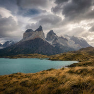 Patagonia Wall Art canvas print, sheer granite towers above a turquoise glacial lake and windswept golden steppe