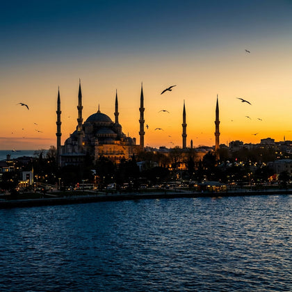 Istanbul Wall Art canvas print, the great domes and six minarets of the Blue Mosque above the Bosphorus at dusk with gulls