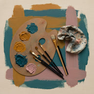 Custom Wall Art canvas print, an artist palette, a fan of brushes and a folded rag laid on a primed cotton canvas