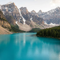 Banff Wall Art canvas print, a brilliant turquoise glacial lake below sheer Rocky Mountain peaks with pine forest