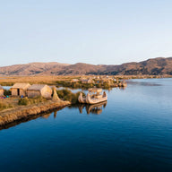 Lake Titicaca Wall Art canvas print, floating reed islands and a traditional reed boat on deep blue high altitude water