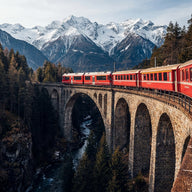 Swiss Alps Wall Art canvas print, a red alpine train crossing a curved stone viaduct high above a forested Swiss gorge