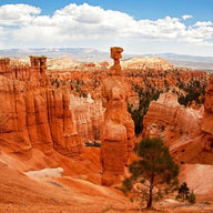 Southwestern wall decor canvas print of Monument Valley buttes in clay orange at sunset