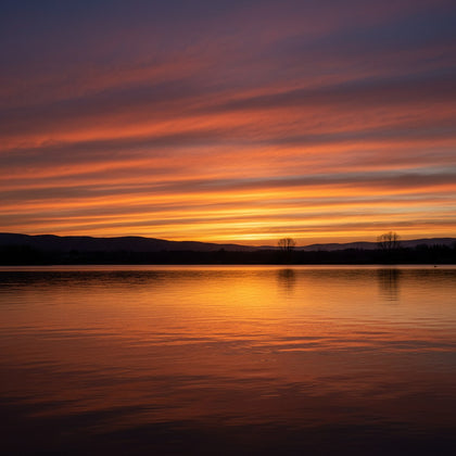 Sunset Wall Art canvas print, a blazing sunset over water, deep orange and crimson banded cloud