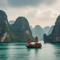 Ha Long Bay Wall Art canvas print, hundreds of limestone karst islands rising from misty emerald water with a traditional