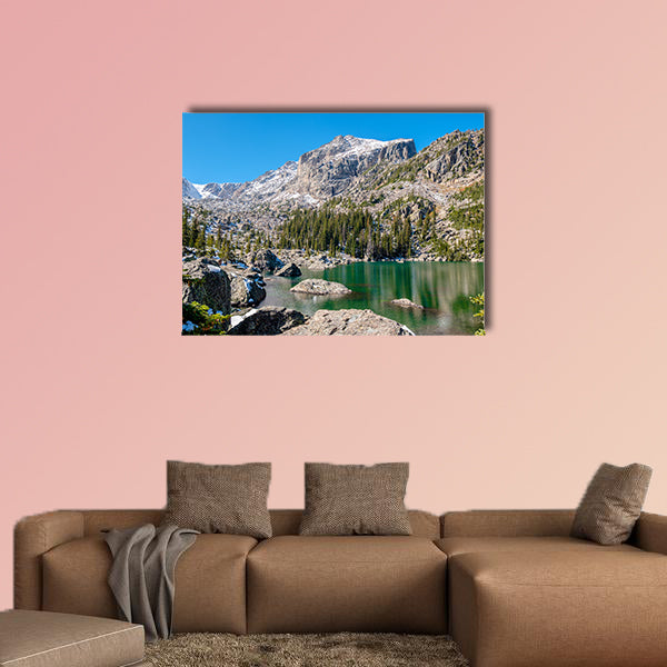 Alpine Lake with Rocky Foreground Canvas Wall Art in gray, green and blue, single panel hung on a wall