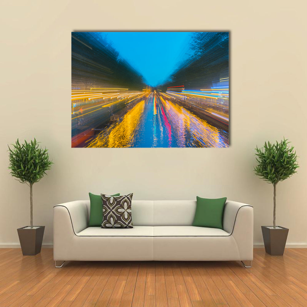 Urban Night Travels Canvas Wall Art in orange, yellow and blue, single panel hung on a wall