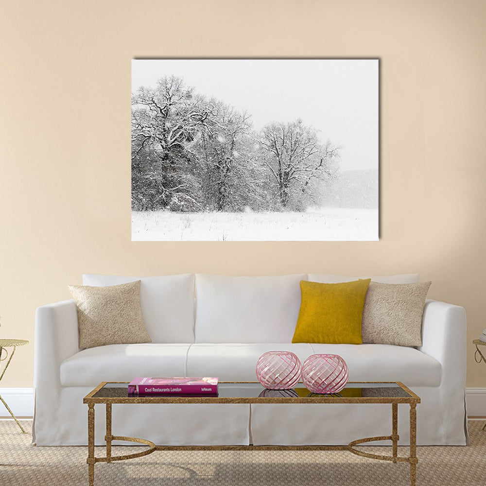 Minimalist Snowy Trees Canvas Wall Art in black, white and gray, single panel hung on a wall