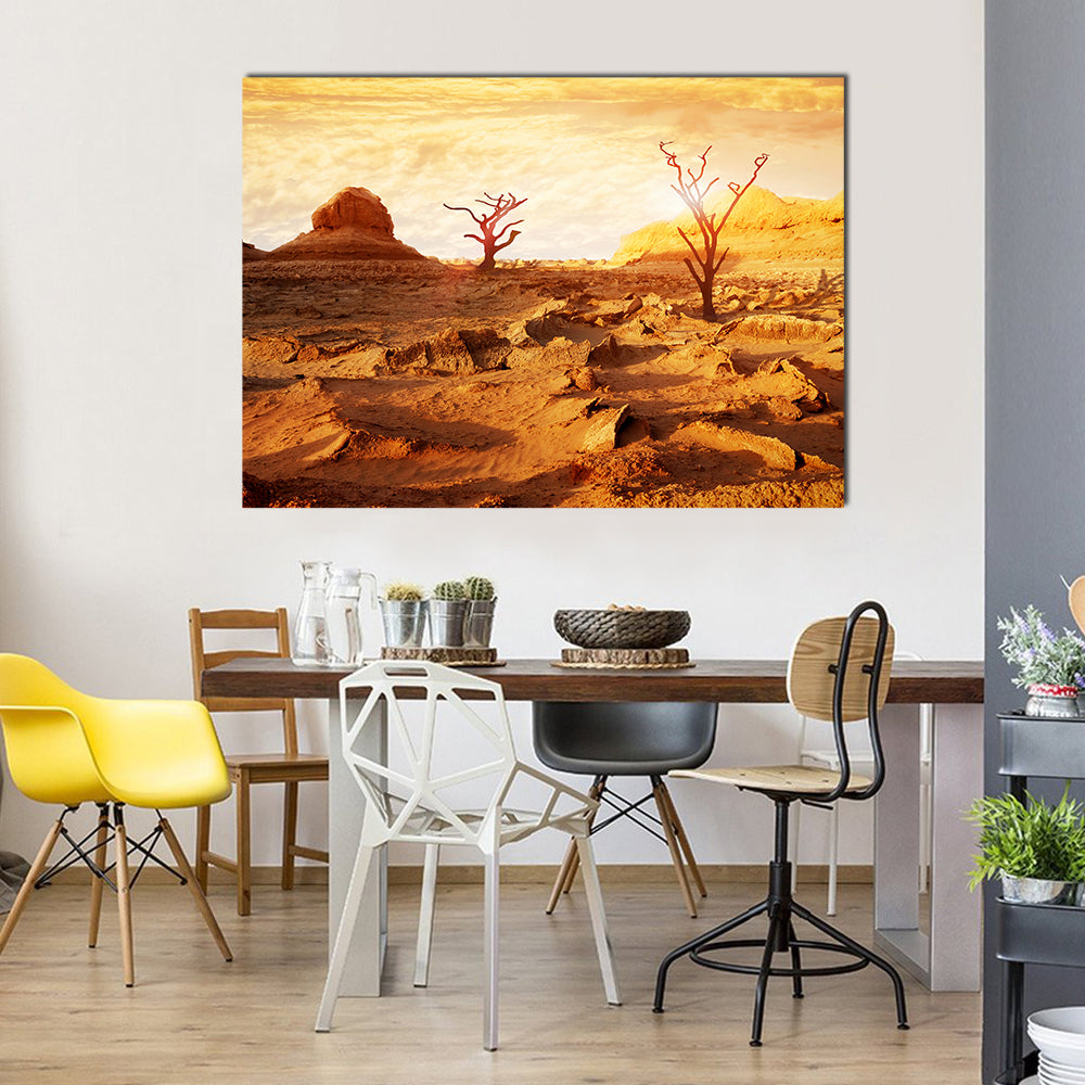 Sunset Over Dry Desert Canvas Wall Art in brown, orange and yellow, single panel hung on a wall