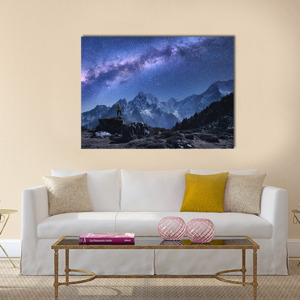 Milky Way Over Snow-covered Peaks Canvas Wall Art in black, blue and purple, single panel hung on a wall