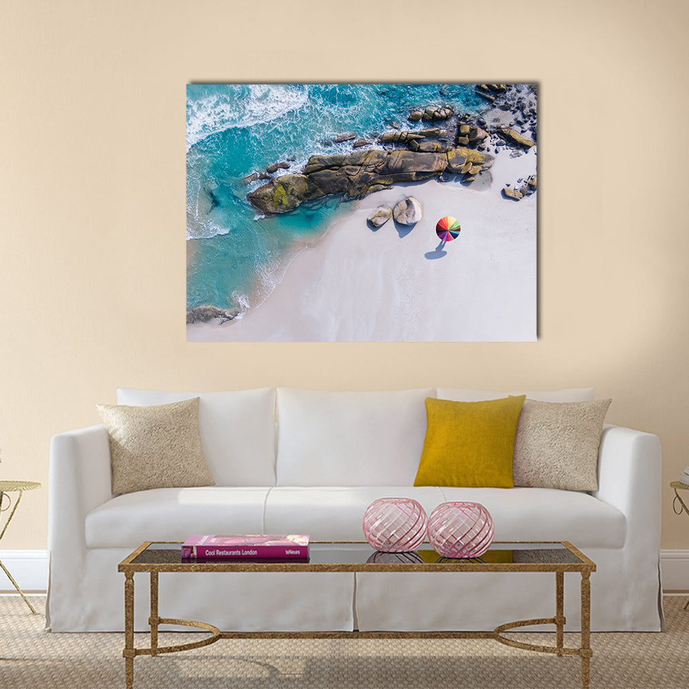 Umbrella On The Beach And Foam Of Sea Wave Canvas Wall Art