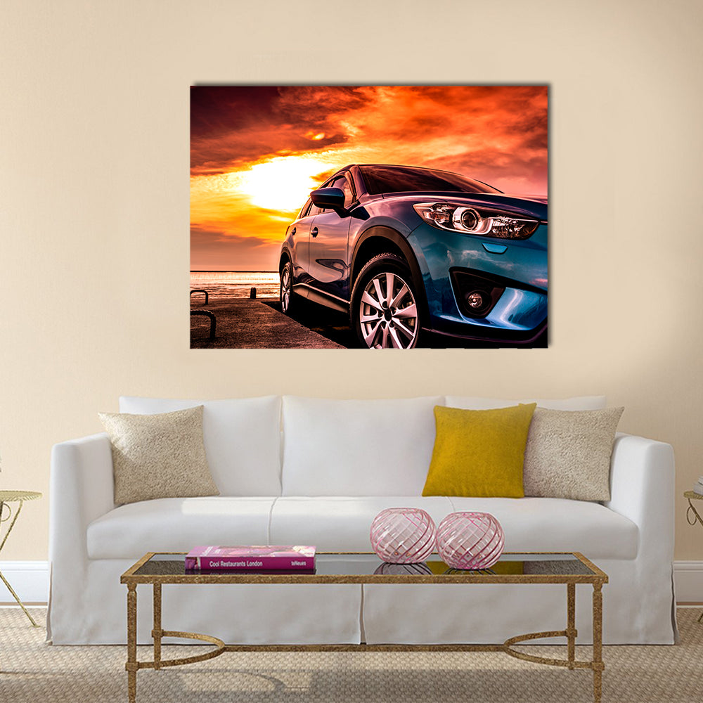 Blue Suv at Coastal Sunset Canvas Wall Art in orange, yellow and blue, single panel hung on a wall