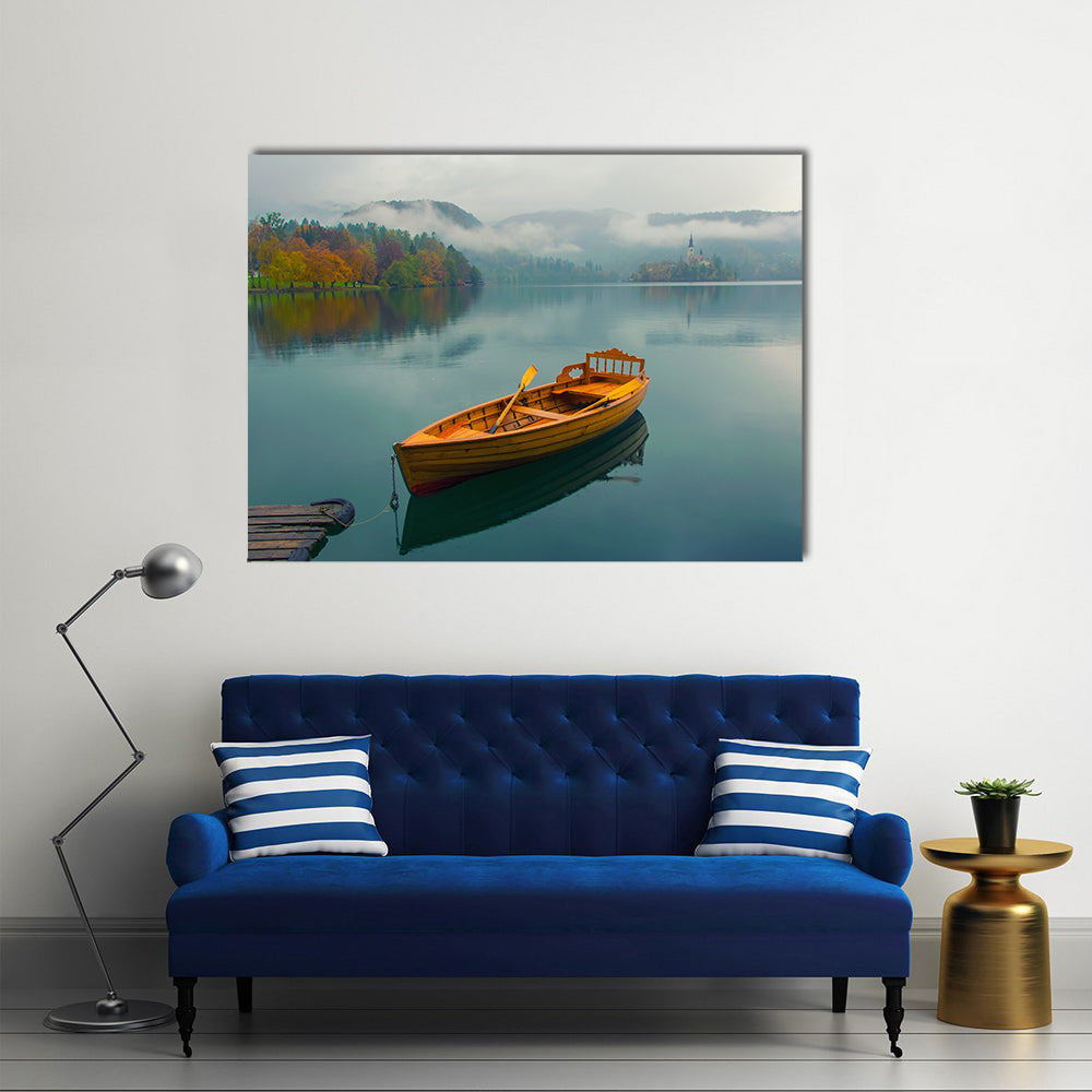 Lonely Boat on Lake Bled Canvas Wall Art in brown, green and blue, single panel hung on a wall