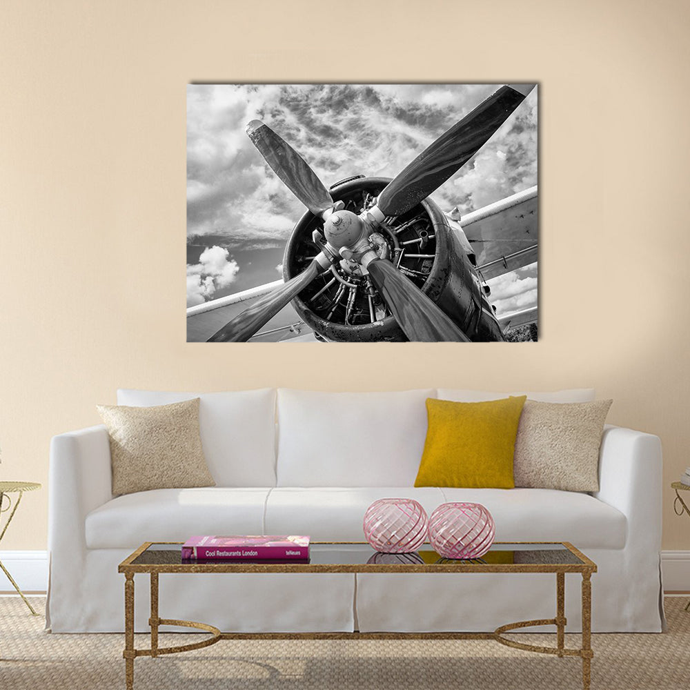 Vintage Airplane Propeller Close-up Canvas Wall Art in black, white and gray, single panel hung on a wall
