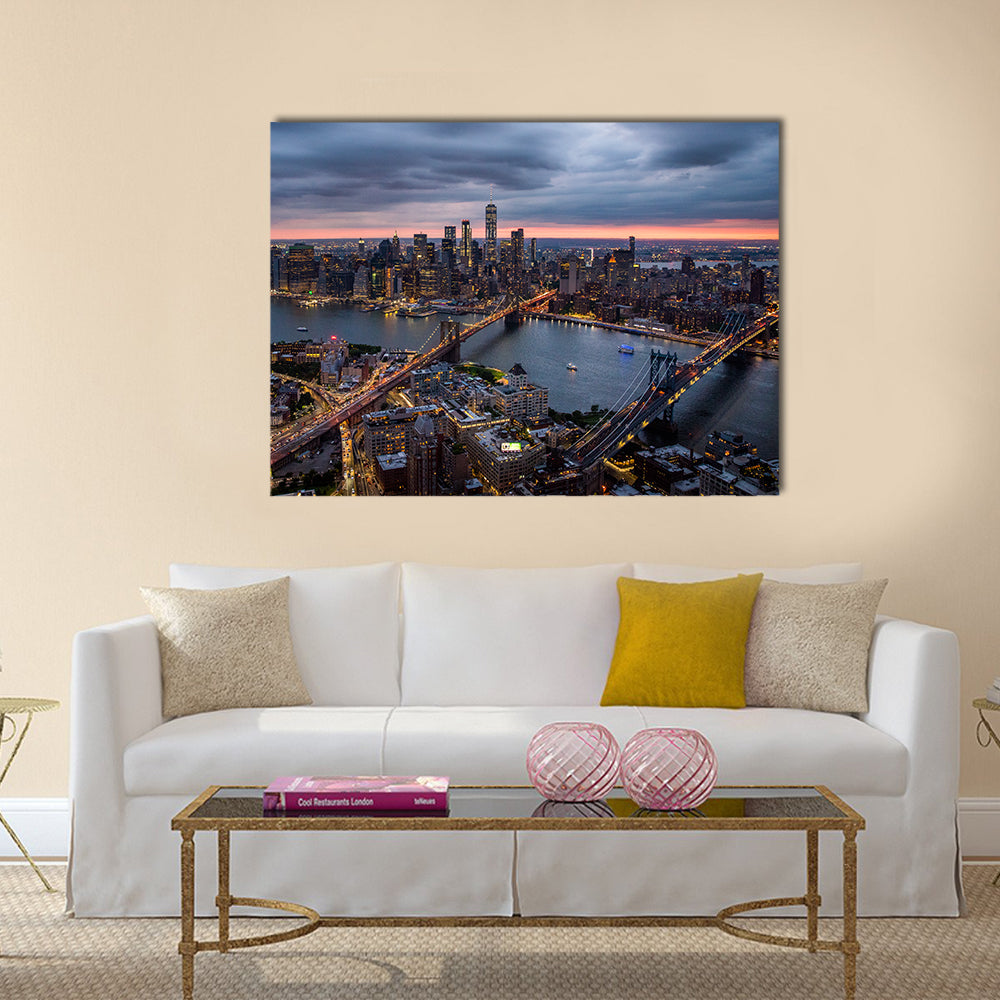 New York City at Night Canvas Wall Art in black, orange and blue, single panel hung on a wall