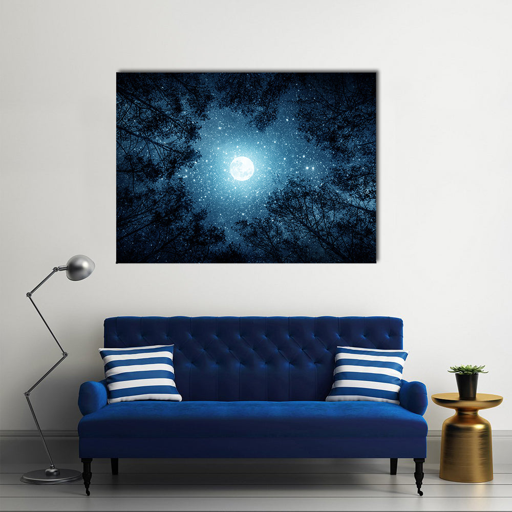 Milky Way And Moon From Forest Trees Canvas Wall Art in black, blue and navy, single panel hung on a wall