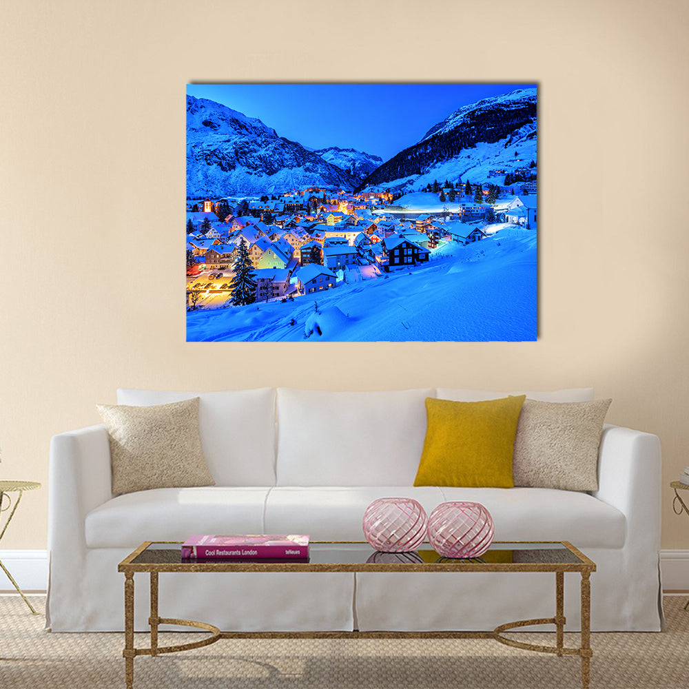 Andermatt Village In Swiss Alps Mountains Canvas Wall Art in white and blue, single panel hung on a wall