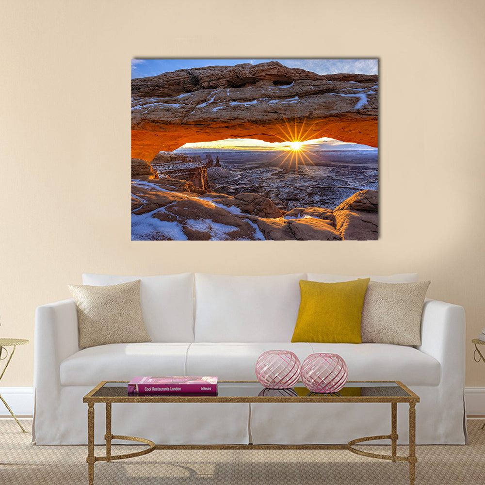 Mesa Arch In Canyonlands National Park Utah Canvas Wall Art in brown, orange and blue, single panel hung on a wall