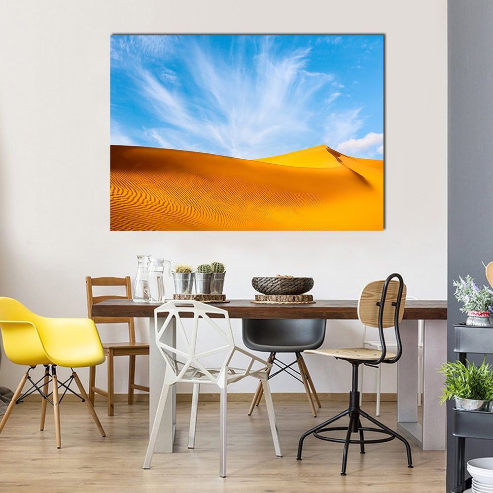 Golden Sand Dunes Landscape Canvas Wall Art in orange, yellow and blue, single panel hung on a wall