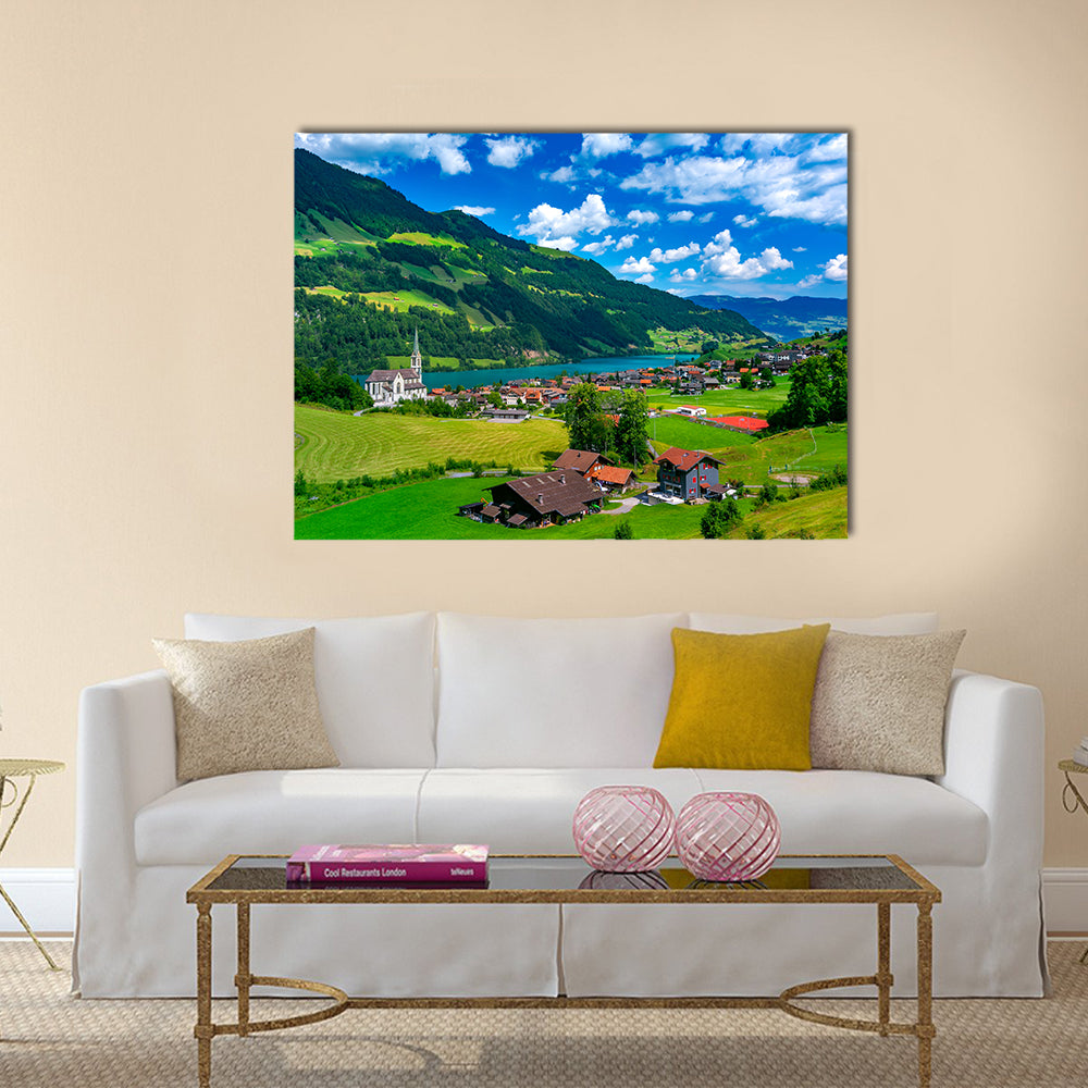 Swiss Village Lungern In Switzerland Canvas Wall Art in green and blue, single panel hung on a wall