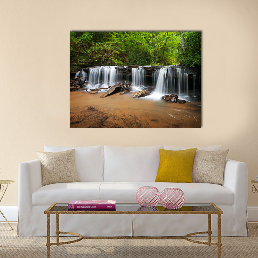 Peaceful Forest Waterfalls Canvas Wall Art in white, brown and green, single panel hung on a wall