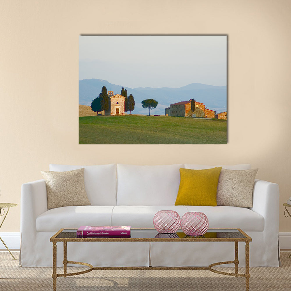 Tuscan Landscape with Cypress Trees Canvas Wall Art in beige, green and blue, single panel hung on a wall