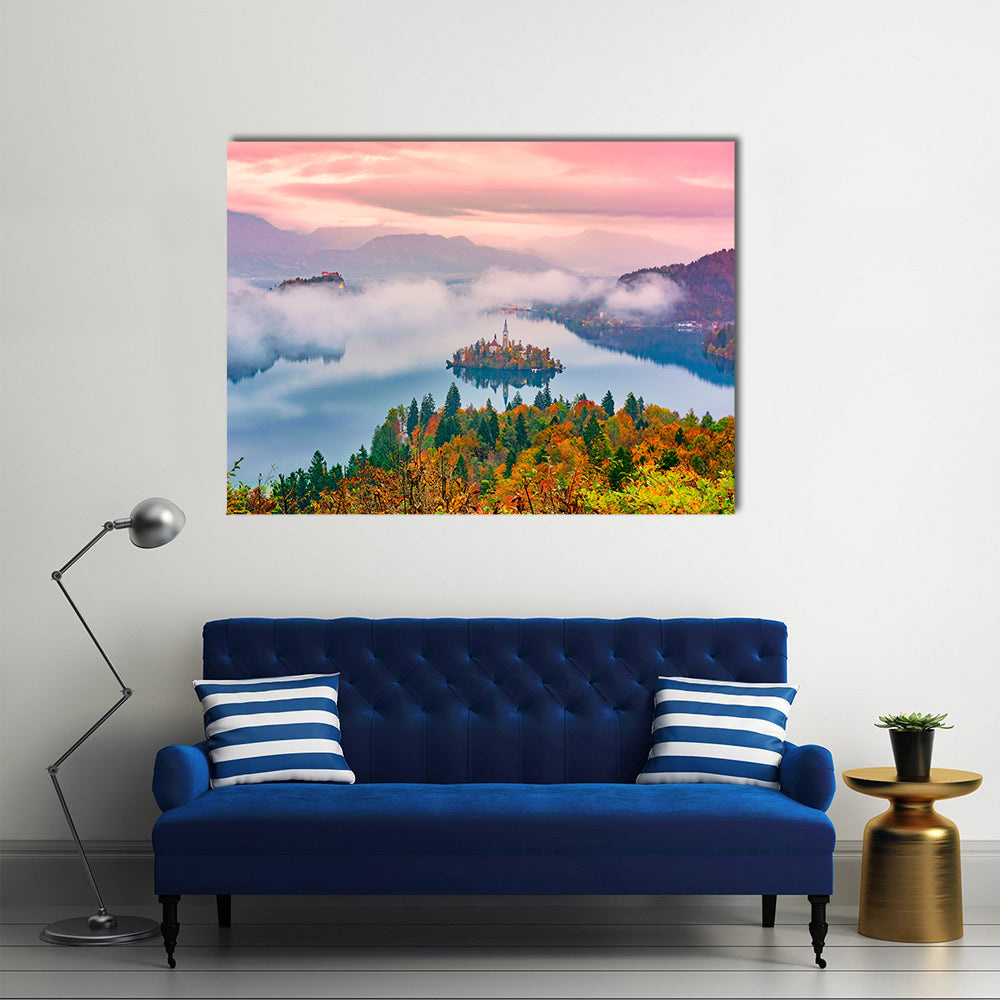 Lake Bled at Sunrise Canvas Wall Art in orange, blue and pink, single panel hung on a wall