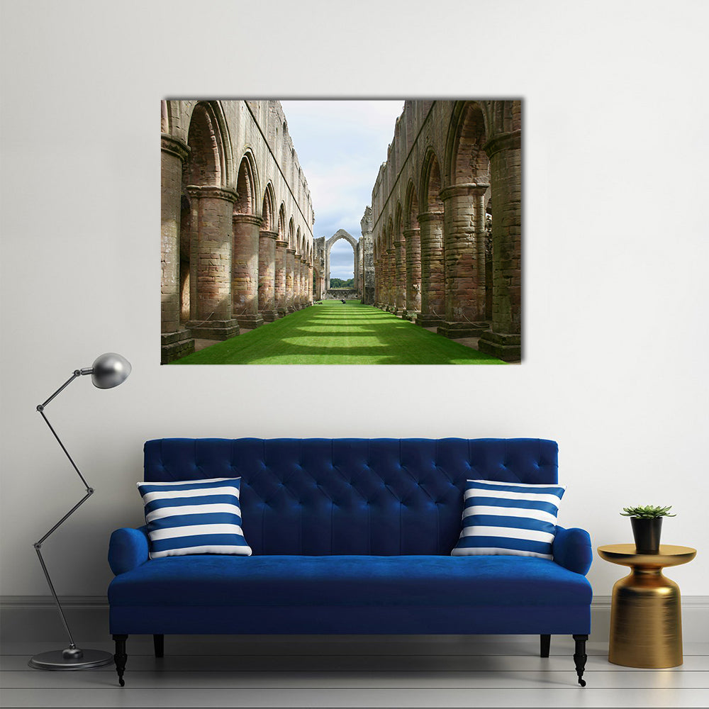 Ruins of Fountains Abbey Canvas Wall Art in gray, brown and green, single panel hung on a wall