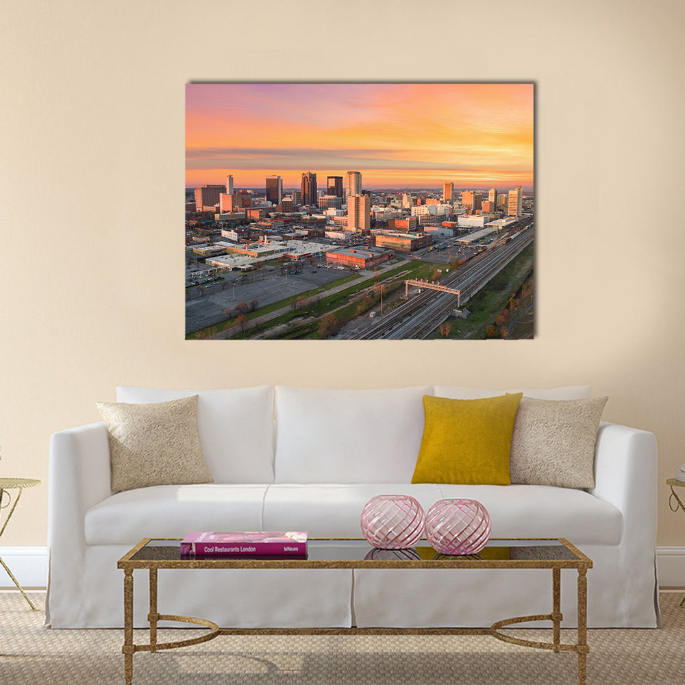 Birmingham Downtown Skyline at Sunset Canvas Wall Art in gray, orange and purple, single panel hung on a wall