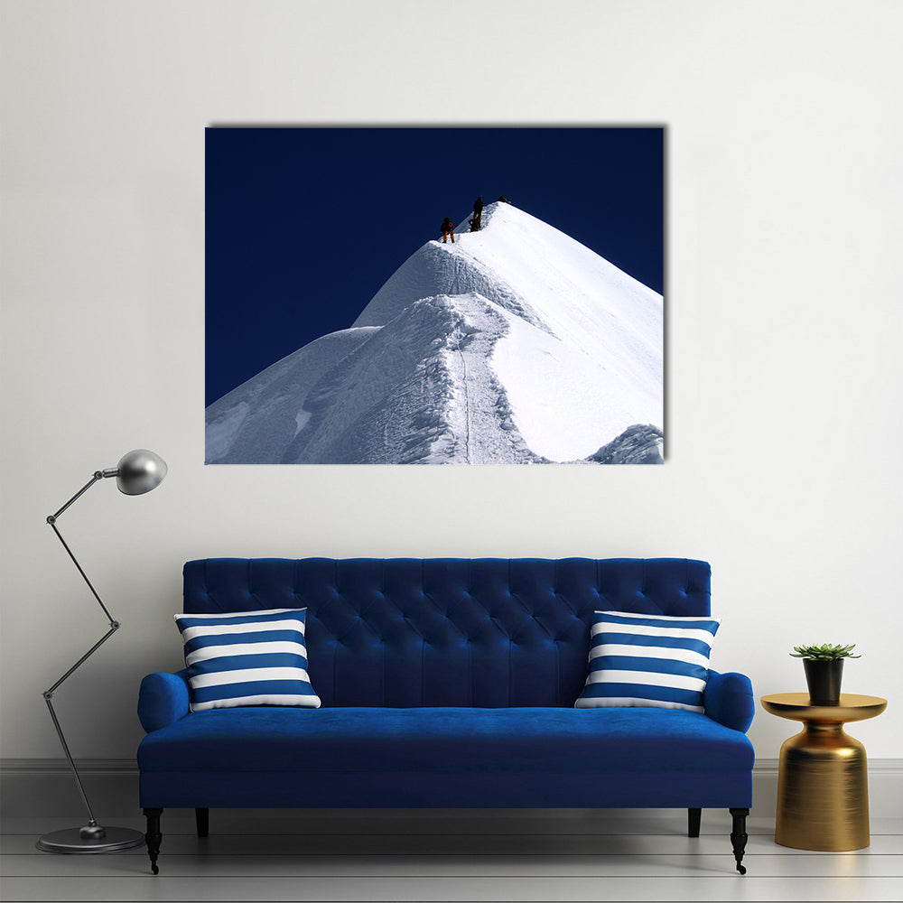 Climbers on Nepal Mountain Peak Canvas Wall Art in white, blue and navy, single panel hung on a wall